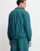 adidas Originals Яке Firebird Jacket в тюркоазено преходен модел KC0684