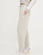adidas Спортен панталон Essentials в бежово с изчистен дизайн JC8305