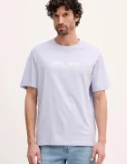 CALVIN KLEIN JEANS Памучна тениска в синьо с принт LV14RE831G