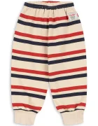 Konges Sløjd спортен панталон за деца от памук LOU STRIPE SWEAT PANTS GOTS бежов със стандартна талия KS106117