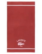 Lacoste Памучна плажна кърпа LORIGINE Sierra 90 x 160 cm