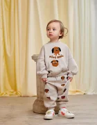 MINI RODINI Детски памучен спортен панталон Doggies в сиво с принт 26130126