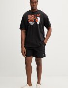 Puma Памучна тениска Junior Varsity Tee в черно с принт 692306