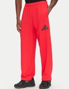 adidas Долнище анцуг Essentials JF3601 Червен Loose Fit