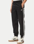adidas Долнище анцуг Firebird Woven KE1371 Черен Regular Fit