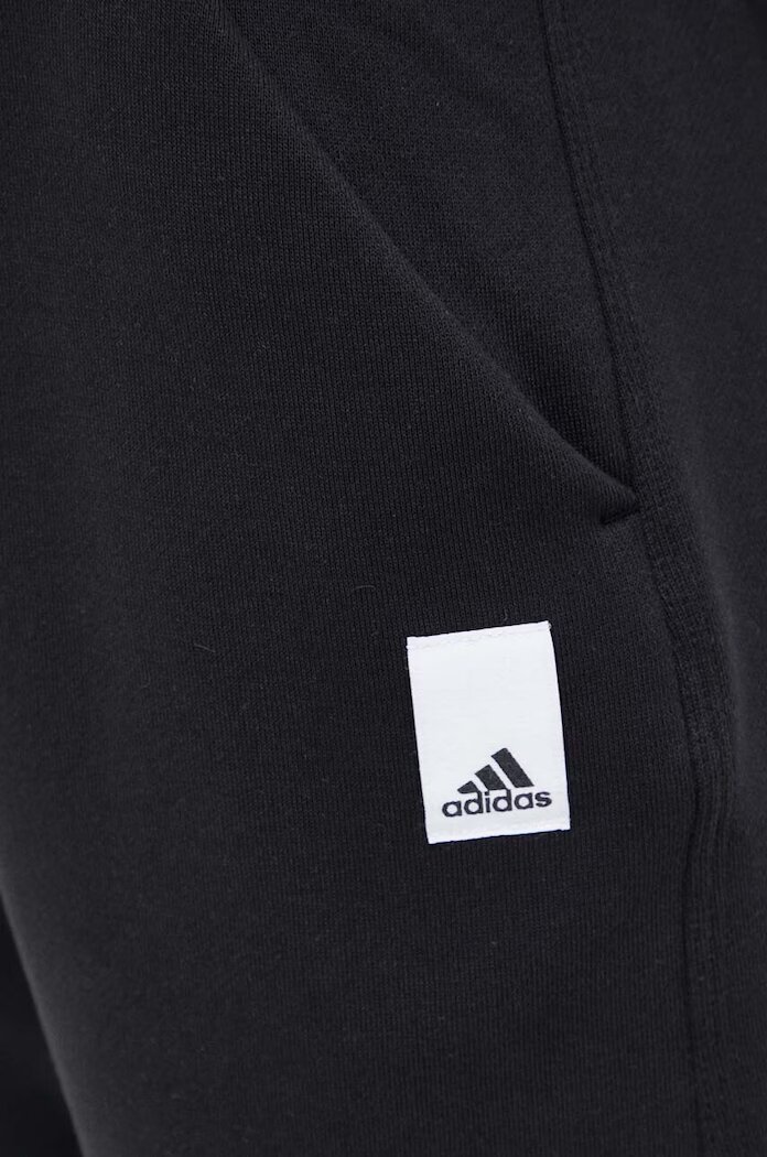 adidas Спортен панталон в черно с изчистен дизайн