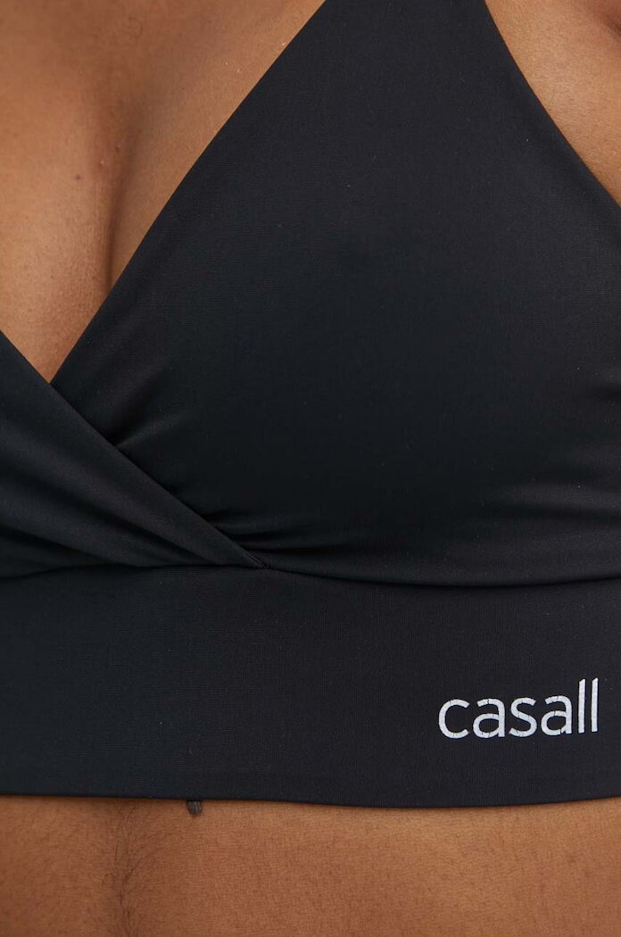 Casall Спортен сутиен Wrap в черно с изчистен дизайн