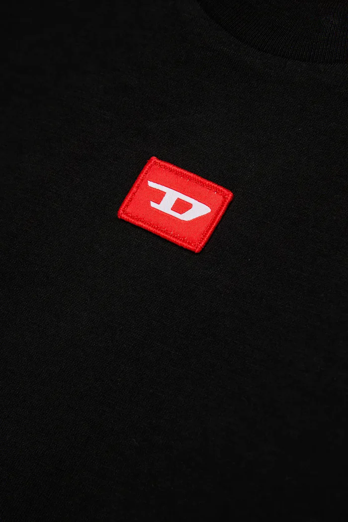 Diesel Детска памучна тениска TXDIEGO T-SHIRT в черно с апликация J02501