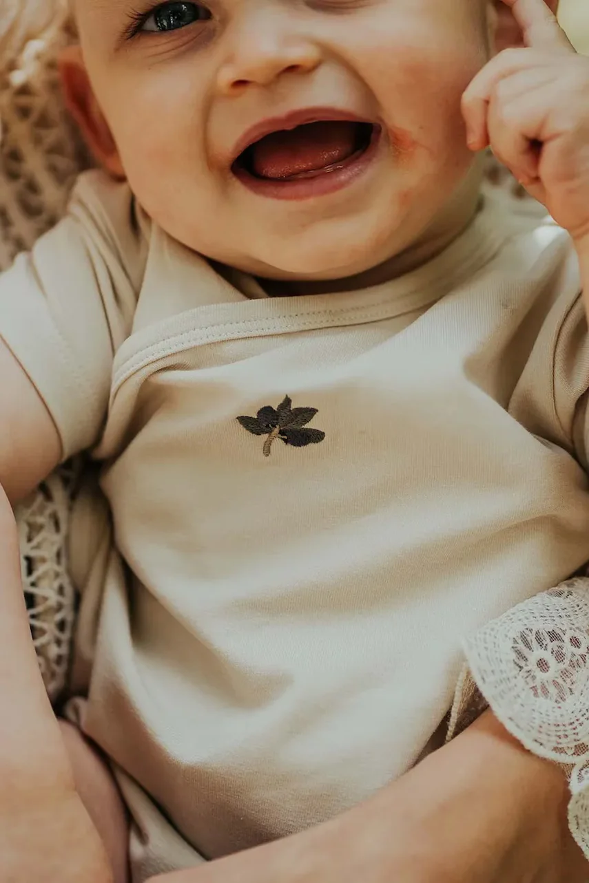 Donsje Бебешко боди от памук Cadey Bodysuit Olive
