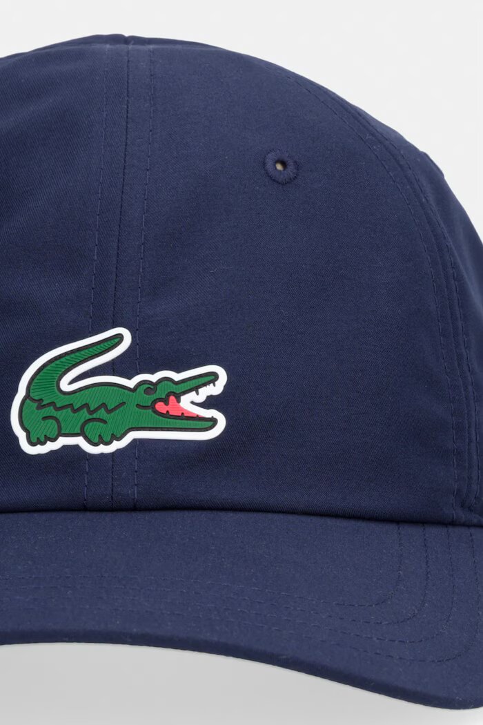 Lacoste Шапка с козирка в лилаво с апликация RK2450