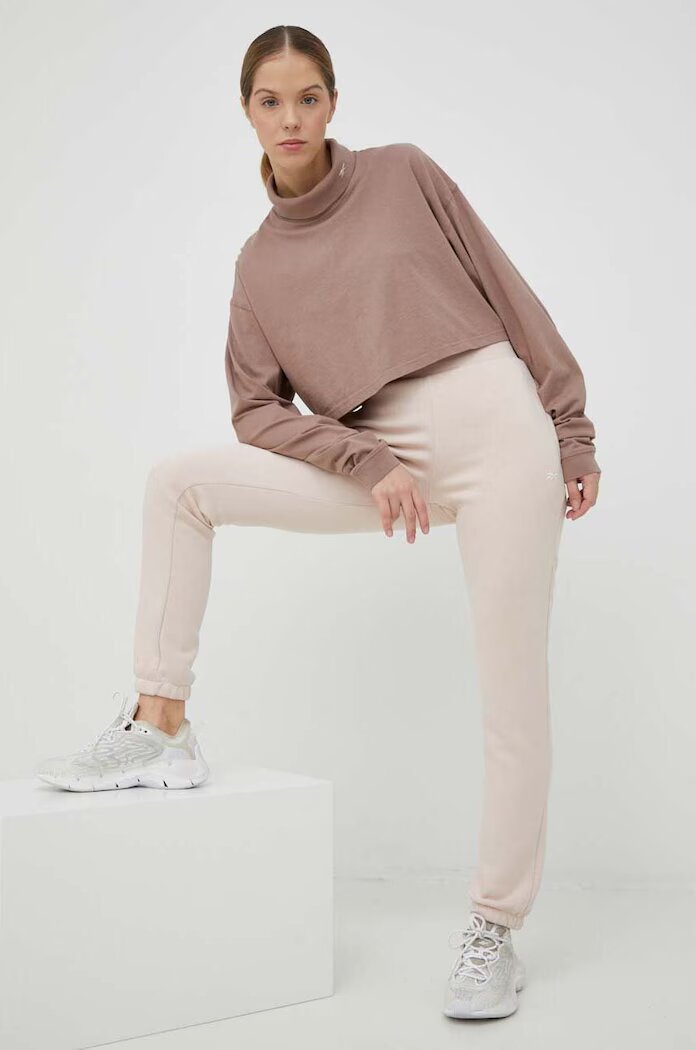 Reebok Спортен панталон в розово с изчистен дизайн