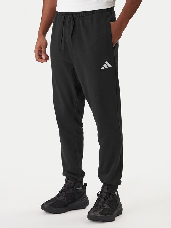 adidas Долнище анцуг Essentials Feel Cozy JE3854 Черен Regular Fit